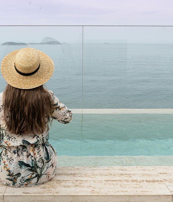 Serene woman focusing on the horizon with green accents